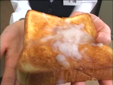 office worker eats a slice of toast