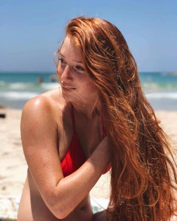 sunbathing redhead