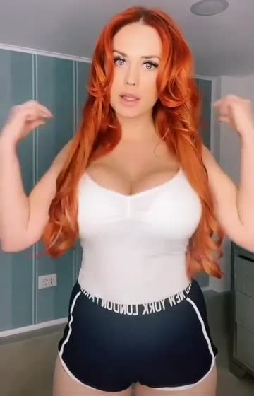 sexy and busty redhead