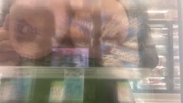 [dared by {yogachick420}] to put my phone in the ice cream [f]reezer at the grocery store, and film myself pressing my boobies up against the glass. geez, this one was risky, the place was packed!
