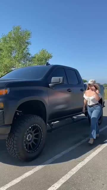perfect bum with jeans wedged up deeply stepping out of a car