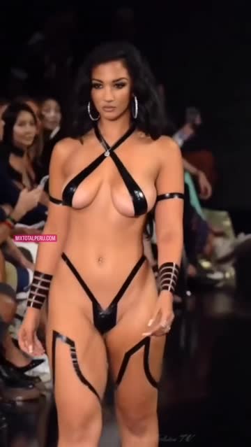 model on stage with stripes cover tits and ass