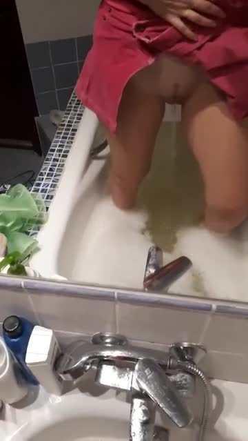 warming her bath water