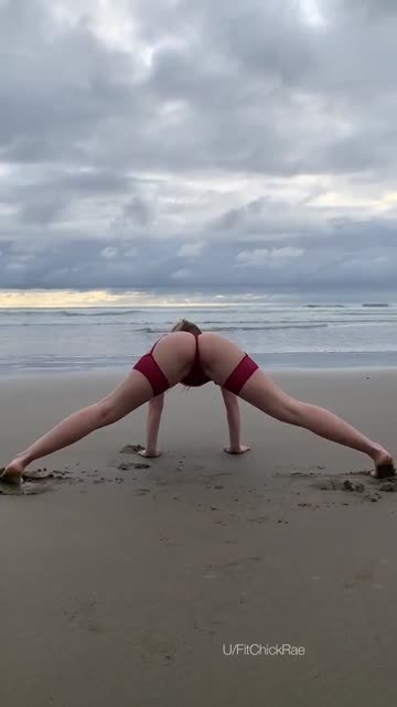 stretching in the wet sand (f)
