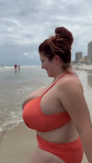 overflowing her huge bikini
