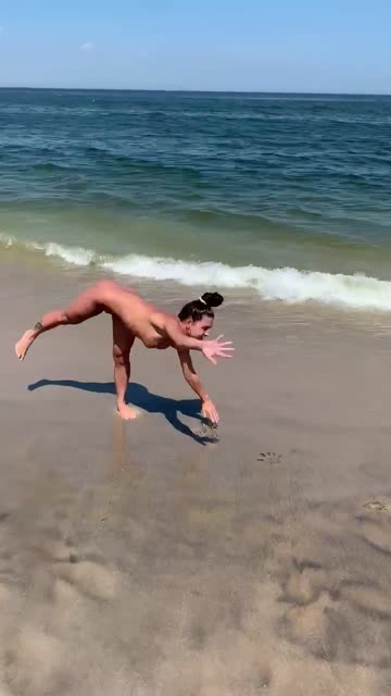 practicing cartwheels on the beach