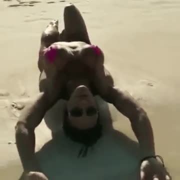 sexy posing in slingshot at public beach