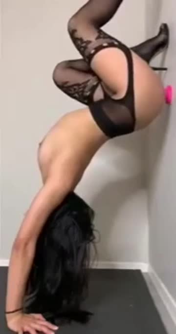 handstand with a dildo wall