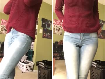 holding on the left, letting go on the right in jeans and a red shirt