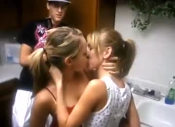 blondes kissing at a party