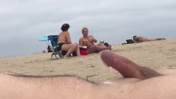 guy pretends to be asleep on the beach while people watch him cum 2