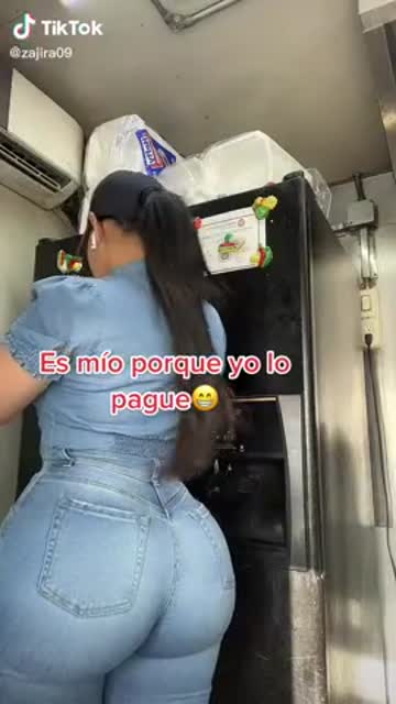 big ass parked in front of a fridge