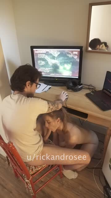 having fun throating his dick and making it twitch while he's using his pro gamer set-up