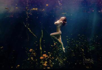 floating naked amongst lily pads (by @kruzphoto)