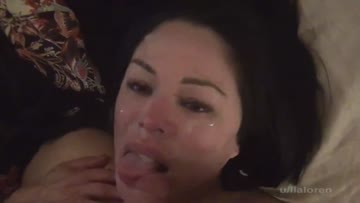 face covered in cum, licking the tip for a few more drops!