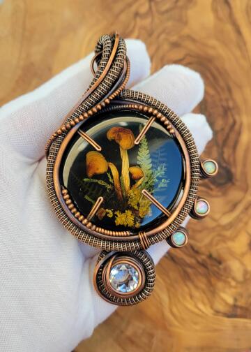 i made a pendant using real fungi + flora. happy spring!