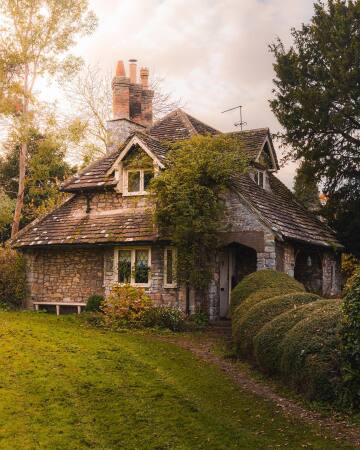 rose cottage, a small stone cottage in blaise hamlet, henbury, north bristol, england.