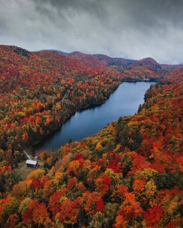 narrow lake in the adirondack mountains during autumn, upstate new york.