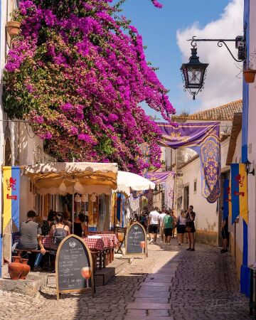 cobblestone street in the historic walled town of Óbidos, leiria district, central portugal.