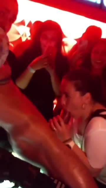girl sucks male stripper on stage