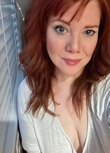 redhead with blue eyes and freckles in a white t-shirt (f41)