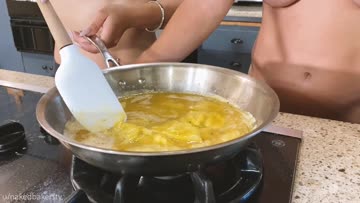 teaching my friend how to cook breakfast.