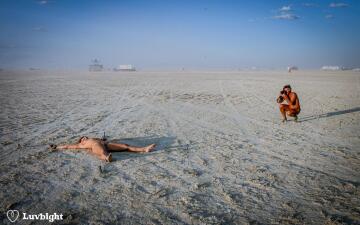 when someone asks if they can take a photo of your slave, the polite thing is to say yes. dee luvbight, burning man, 2004.