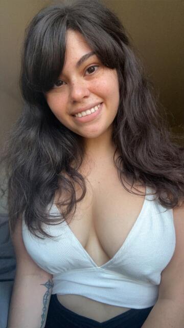 no makeup and some teasing cleavage