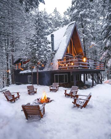 a-frame cabin surrounded by the winter forest in adirondack park near lake placid, the adirondack mountains, upstate new york.