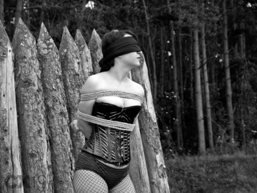 bound and blindfolded outdoors