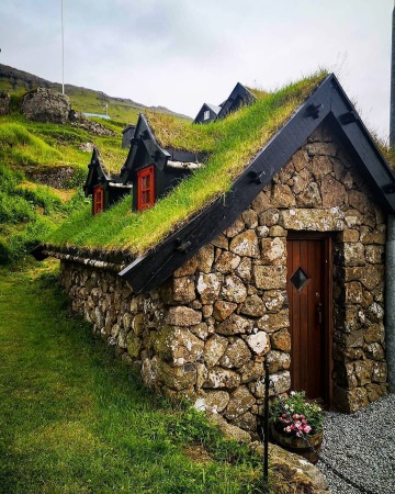 turf roof house in the small village of leynar, island of streymoy of the faroe islands, denmark.