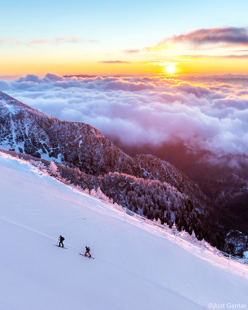 sunrise over a sea of clouds seen from the slopes of mount krvavec near veliki zvoh, upper carniola, slovenia.