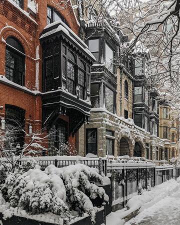 row of old townhouses in the snow, gold coast historic district, chicago, illinois.