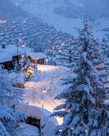 winter night in the resort town of verbier in the alps, valais, southwest switzerland.