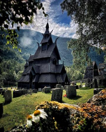 11th century borgund stave church seen from the cemetery, lærdal, vestland county, norway.