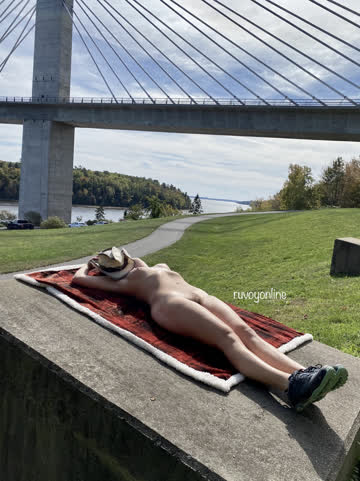 [f] suntanning naked in public beside a highway bridge 🚙