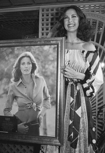 lynda carter holds her award winning poster on jan. 19, 1979 in beverly hills, california. carter was honored in the presentation of a special gold poster award for the number one selling poster of 1978.