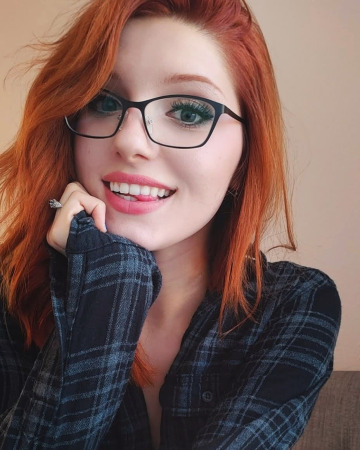 pretty redhead with glasses