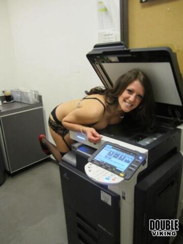 secretary mashes her tits against the copier