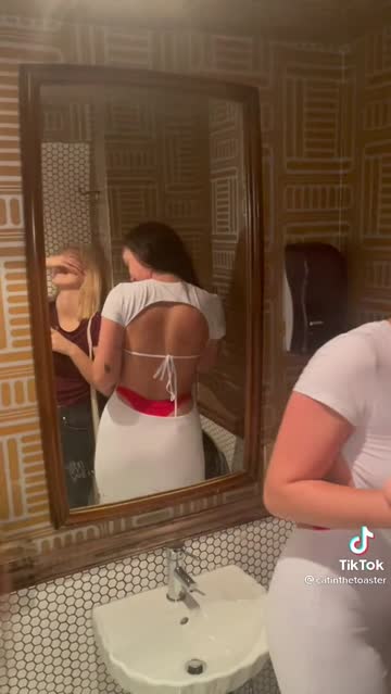 red thong in a backless white dress