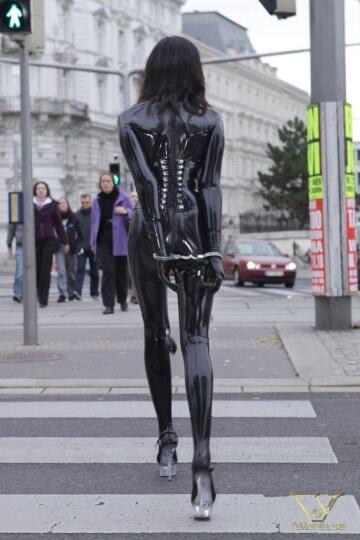 latex, corset, cuffed and plugged. perfect for a walk in the city!