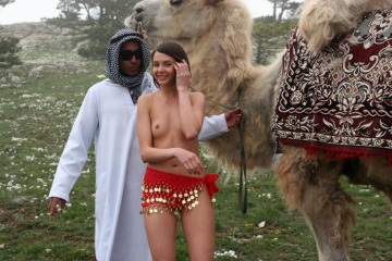 there is a naked girl but with a camel (bactrian)