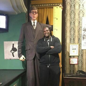 robert pershing wadlow (wax statue), the tallest man ever, next to shaquille o’niel.