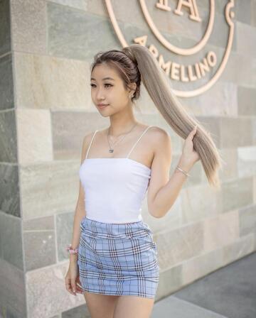 another asian in a tight skirt