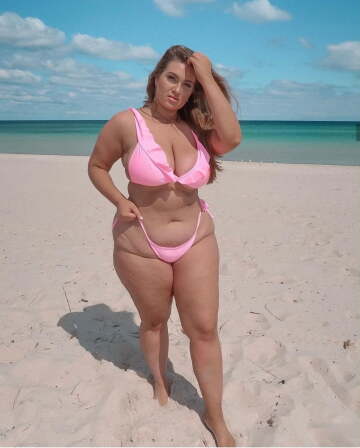 chunky tan blonde in a pink bikini