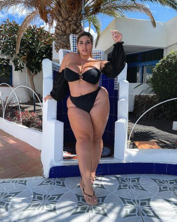 natalia lozano looking plump and sexy in a black bikini