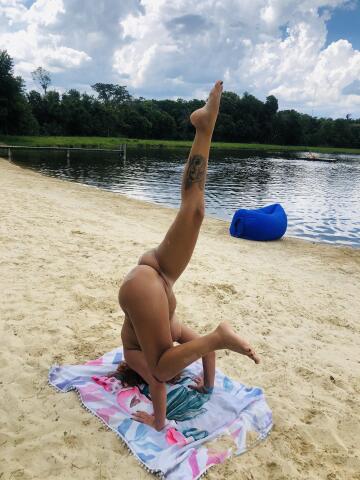 practicing yoga poses 🧘‍♀️ at the beach 🏝