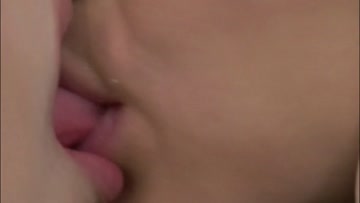 2 women tongue kiss closeup