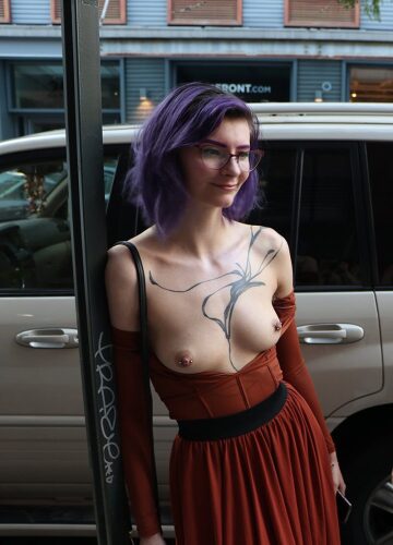 this amazing open front dress lets this lady's boobs show their natural beauty