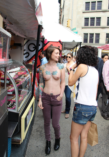 street market : perhaps the tattoos are a substitute for clothes?